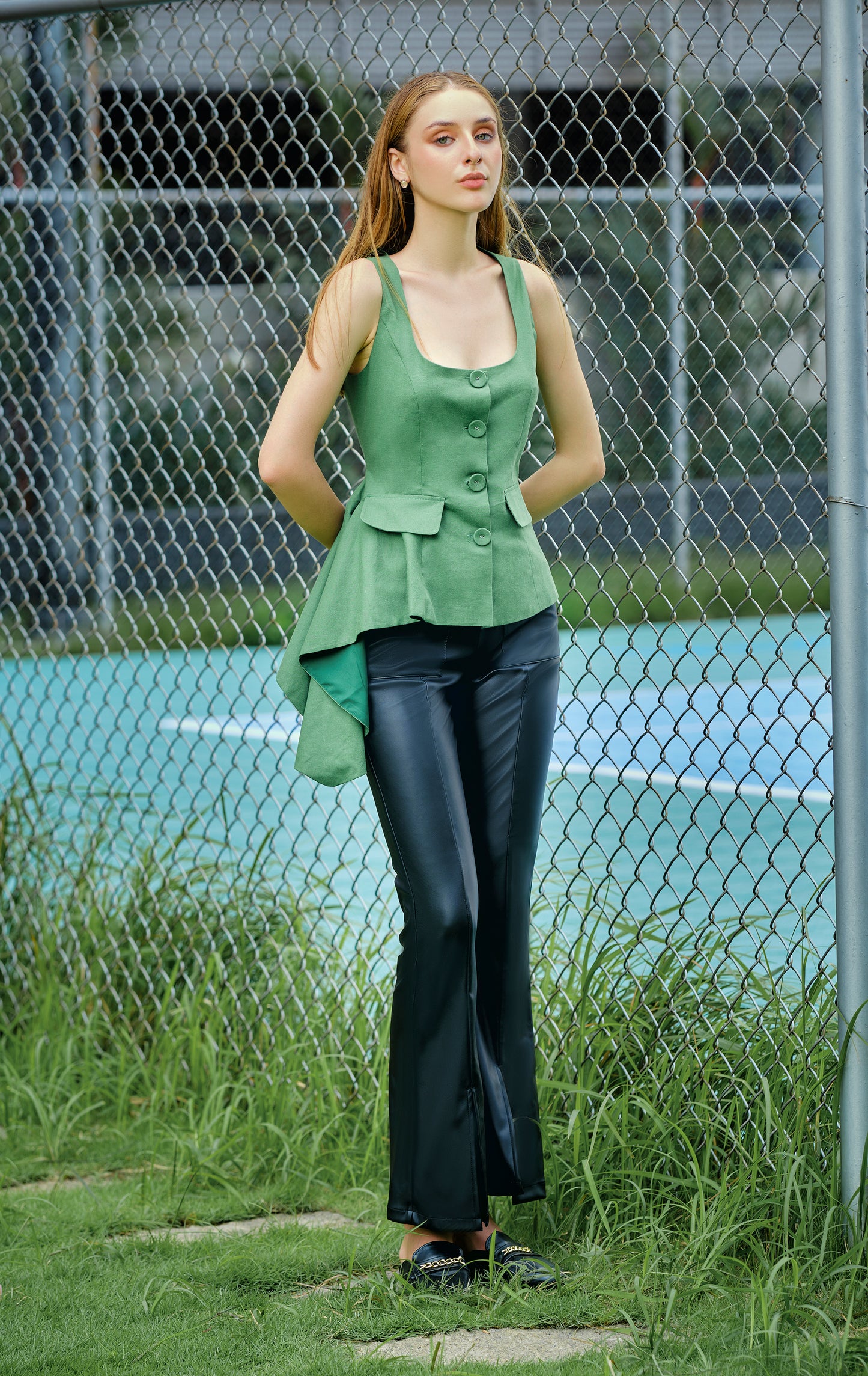 Asymmetric peplum waistcoat in green